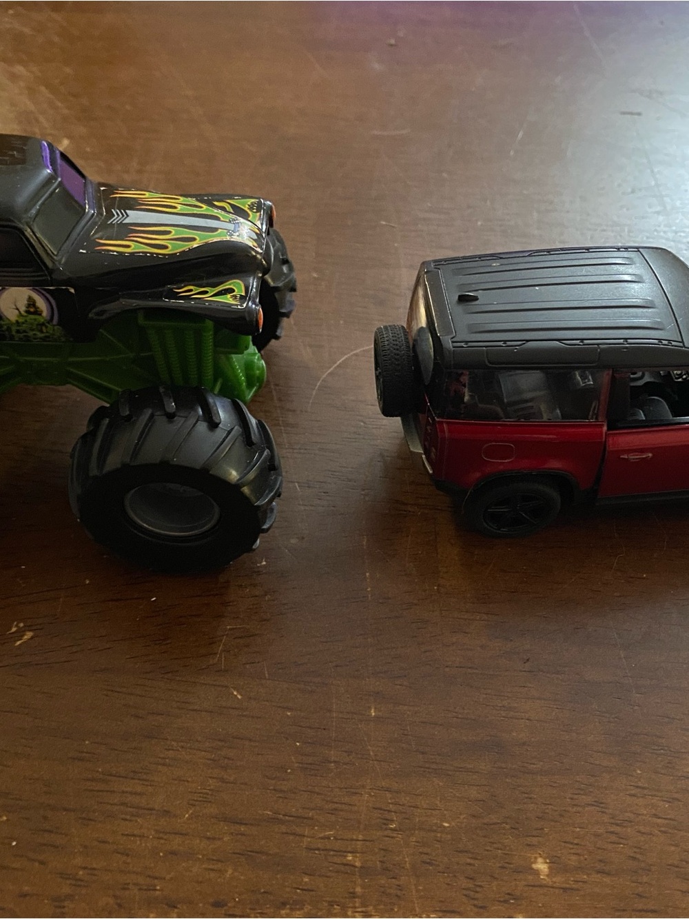 Assorted toy cars and trucks - 4 in all
